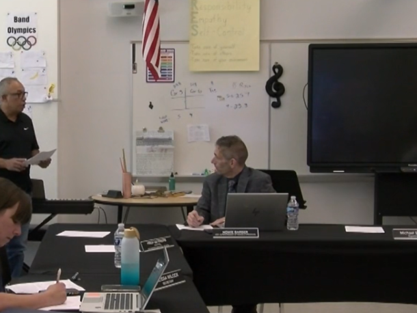Luis Rivera, left, speaks during a May 7 school committee meeting. Photo source: ORCTV