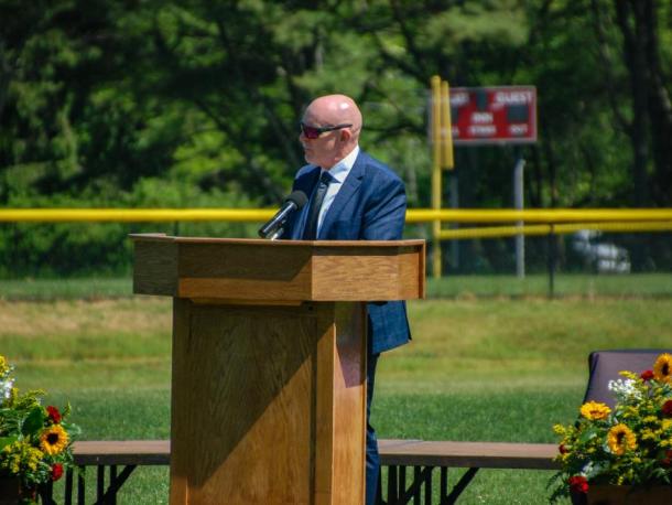 Gary Linehan, principal of Old Colony Regional Vocational Technical High School, speaks at a graduation. Photo by Grace Roche