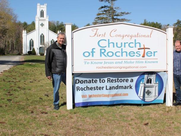 Pastor Colby Olson, right, trustee Michael Costa erect a fundraising banner with the church in the background. Photos source: First Congregational Church of Rochester