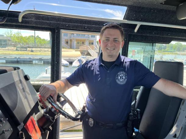 Cameron Wentworth poses in the harbormaster's boat. Photo by Grace Roche