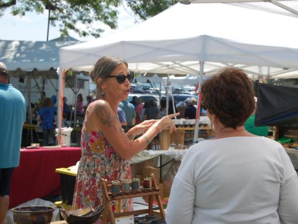 Maureen Starr talks to a customer during Harbor Days at Shipyard Park. Photos by Grace Roche