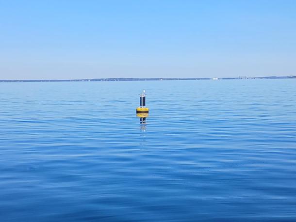 An offshore wave buoy floats off the coast of Mattapoisett in Buzzards Bay. Photo source: Stone Living Lab.