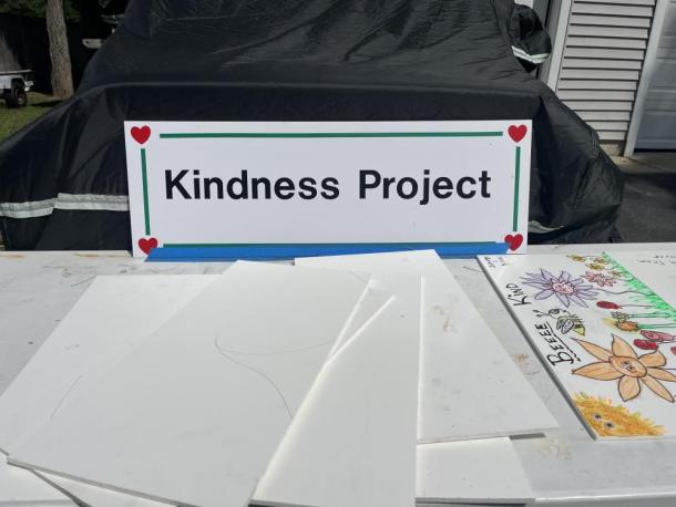 A table on Stan Bradford's property offers boards for people to decorate and return for his Kindness Project. Photos by Grace Roche