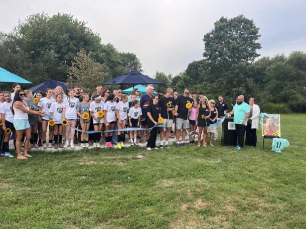 The Eitas family, surrounded by Madelyn's friends and soccer community, cut a ribbon to open Maddie's Circle at the Mariner Youth Soccer Complex on Friday, Aug. 28. Photos by Grace Roche