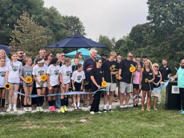 The Eitas family, surrounded by Madelyn's friends and soccer community, cut a ribbon to open Maddie's Circle at the Mariner Youth Soccer Complex on Friday, Aug. 28. Photos by Grace Roche