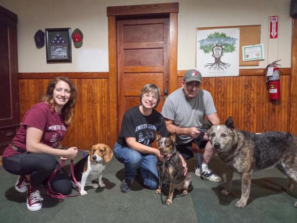 Dog trainers Cristina Fredette and Sherri Swindle, as well as Swindle’s husband, pose with their dogs. Photos by Tanvi Kulkarni