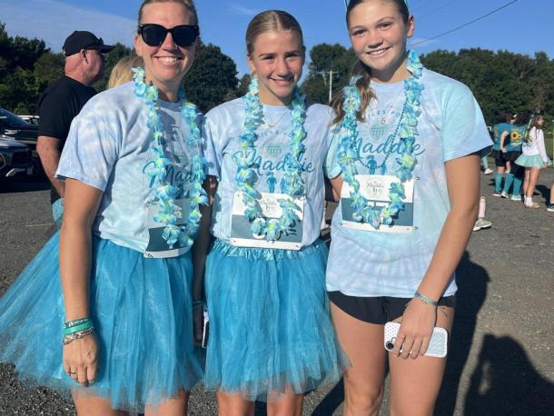 From left: Erin Norton, Cameron Norton and Cali Mills. “We’re here to run for Maddie Eitas, who we’ve known for a very long time,” Erin said. “She’s been very special to us, and we’re here to honor her memory.”