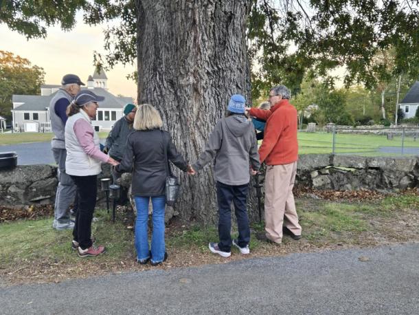 People gather around a 200-year-old red oak tree on Thursday, Oct. 22. Photo source: Sue Maxwell Lewis