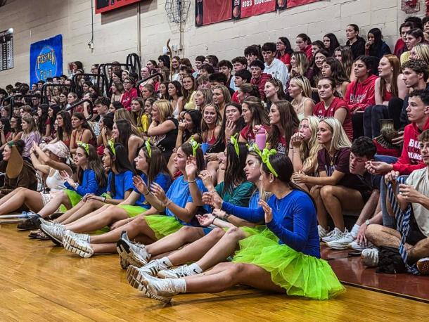Senior students wave their hands in the air during their class skit, which had a "Toy Story" theme. Photos by Tanvi Kulkarni