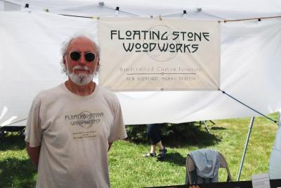 Michael Pietragalla in his booth at the Arts in the Park festival. Photo by: Kenneth Borges.