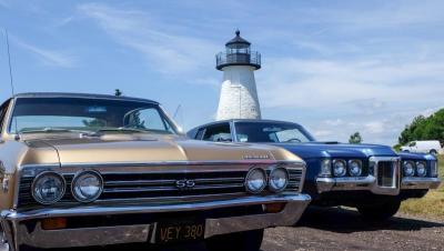 A Chevrolet Chevelle and Pontiac GTO sit parked with Ned’s Point Lighthouse as a backdrop on Sunday, June 28. Photos by: Tim Seeberger