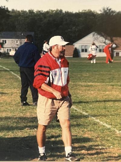 As seen on the sidelines, Rory McFee coaches the girls soccer team. Source: Rory McFee