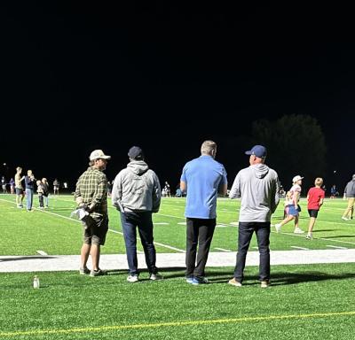 In this photo taken by Tabor sophomore Reya Hovan, Bill Belichick, second from the left, stands to watch the Tabor Academy football game. 
