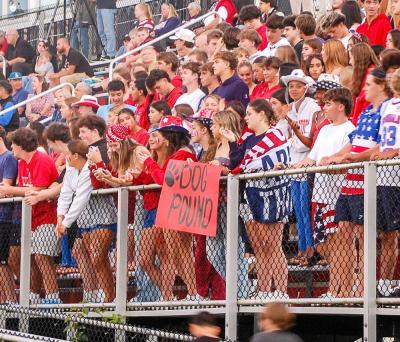 Bulldog fans show their support with signs and cheers. 