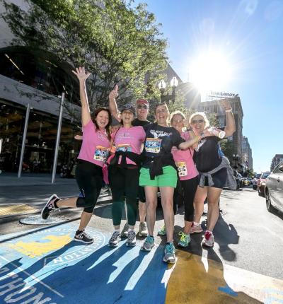 (From left to right) Kara Pernice, Deborah (Pernice) Duffy, Rick Duffy, Donna Tocci, Sue Kindregan and Nora McKenna finish the Jimmy Fund Walk at the marathon finish line in 2016. Source: Donna Tocci