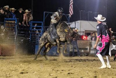 Derick Costa Jr. of Acushnet makes an eight-second bull-ride.