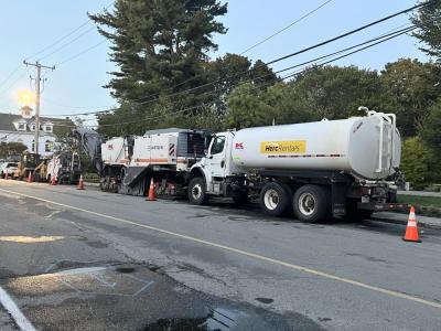Construction vehicles at the intersection of Main Street and Spring Street.