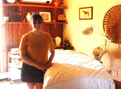 Erica Ingalls, owner of Resurface Skin Studio & Co., poses in a room where she provides treatments.
