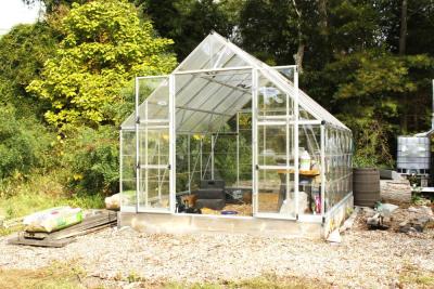 A new greenhouse stands on the property.
