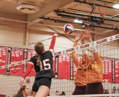 Sophomore Sadie Hartley-Matteson tips the ball over the net. Sophomore Sadie Hartley-Matteson tips the ball over the net.