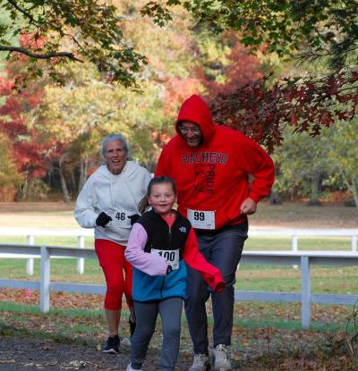 From left to right: Karin Kingsland, Violet Kaselica and Chris Kaselica have fun on the run.