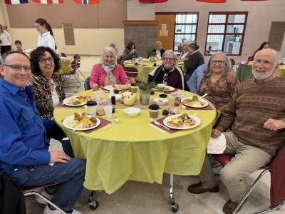 Happy faces spread throughout the cafeteria during the dinner.