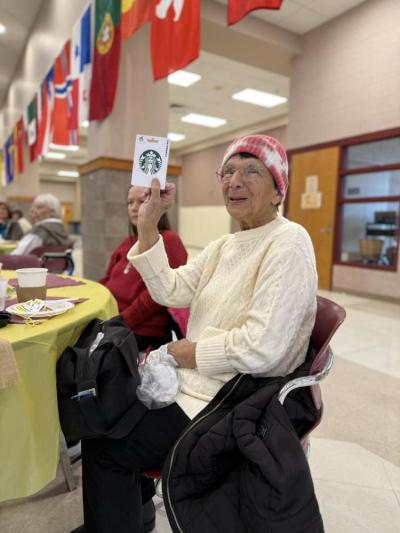 A winner is happy with her prize.