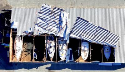 Roof of Triad Boatworks partially torn off in storm. Source: David Curran