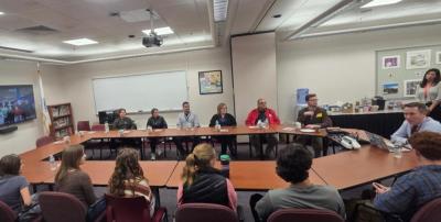 Mike Devoll leads a conversation between Old Rochester and Acushnet representatives.