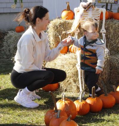 Fairhaven resident Dayme Maloney with her 1-year-old son Bennett Maloney pick out pumpkins. Photos by Grace Ann Natanawan