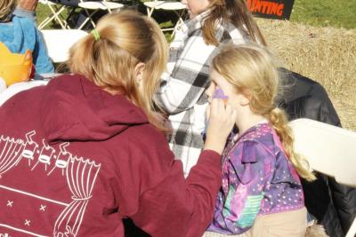 Norah Dawicki, 6, gets her face painted.