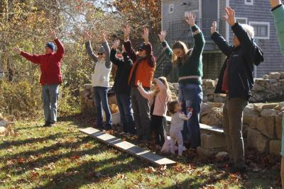 Audience members dance along with Gillman, becoming trees with their arms up.