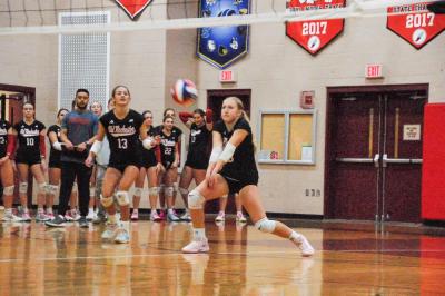 Lucy Lombard returns the ball.