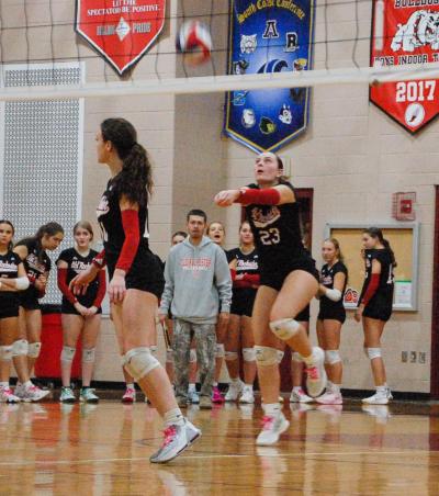 Carly Mello returns a serve with a bump.