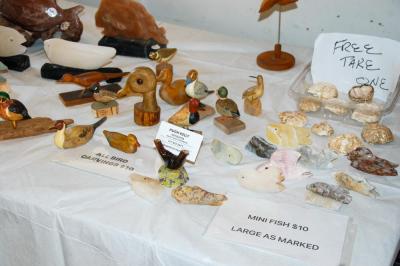 Hugh Kelly uses rocks and wood to craft items. 