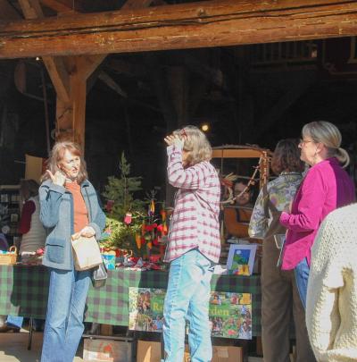 Guests chat as they make their way through the carriage house.