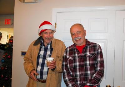 Two friends pose as they share the Christmas spirit.
