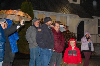 Rochester Police Chief Assad and Pastor Colby Olson watch as the tree is about to be lit.