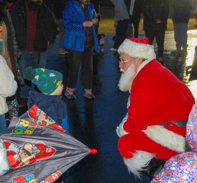 Santa says hello to children.