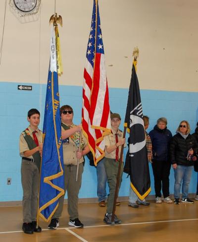 The Boy Scouts present the colors. 