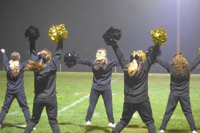 The cheerleaders cheer.