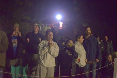 The crowd cheers for a touchdown. 