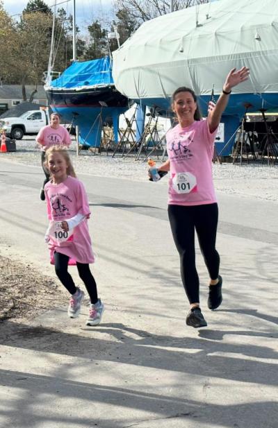 Pease running the first 5k she ever hosted in May 2024 with her daughter, Juliet. This was Juliet's first 5k and the event that inspired her to want to help organize a Santa themed run for MS.