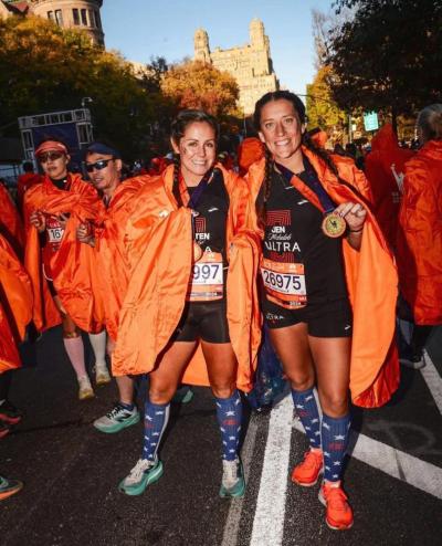 Pease after crossing the finish line of the NYC Marathon in November of 2024 with her running partner, Kristen Wingate.