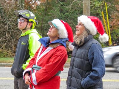 From left: Noah Knowles, Mary Dermody and Sarah French Storer watch the hat installation. 