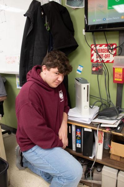 Moskos smiles with his repaired Xbox 360.