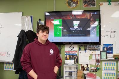 Moskos stands proudly in front of his work. Source: Rick Durta