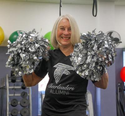 Botelho shakes her pom poms.