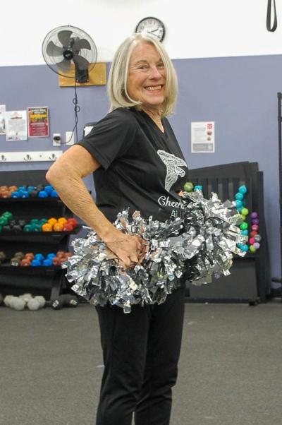 Botelho poses with her pom poms.