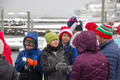 Kids wait at the dock for Santa.
